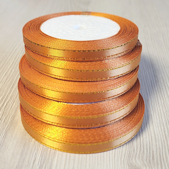 Атласная лента 0,6 см оранжевый (тёмное золото)/золото (бабина) — изображение 1